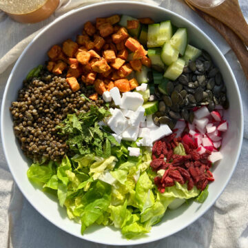 Black lentils and sweet potato salad big and colorful bowl