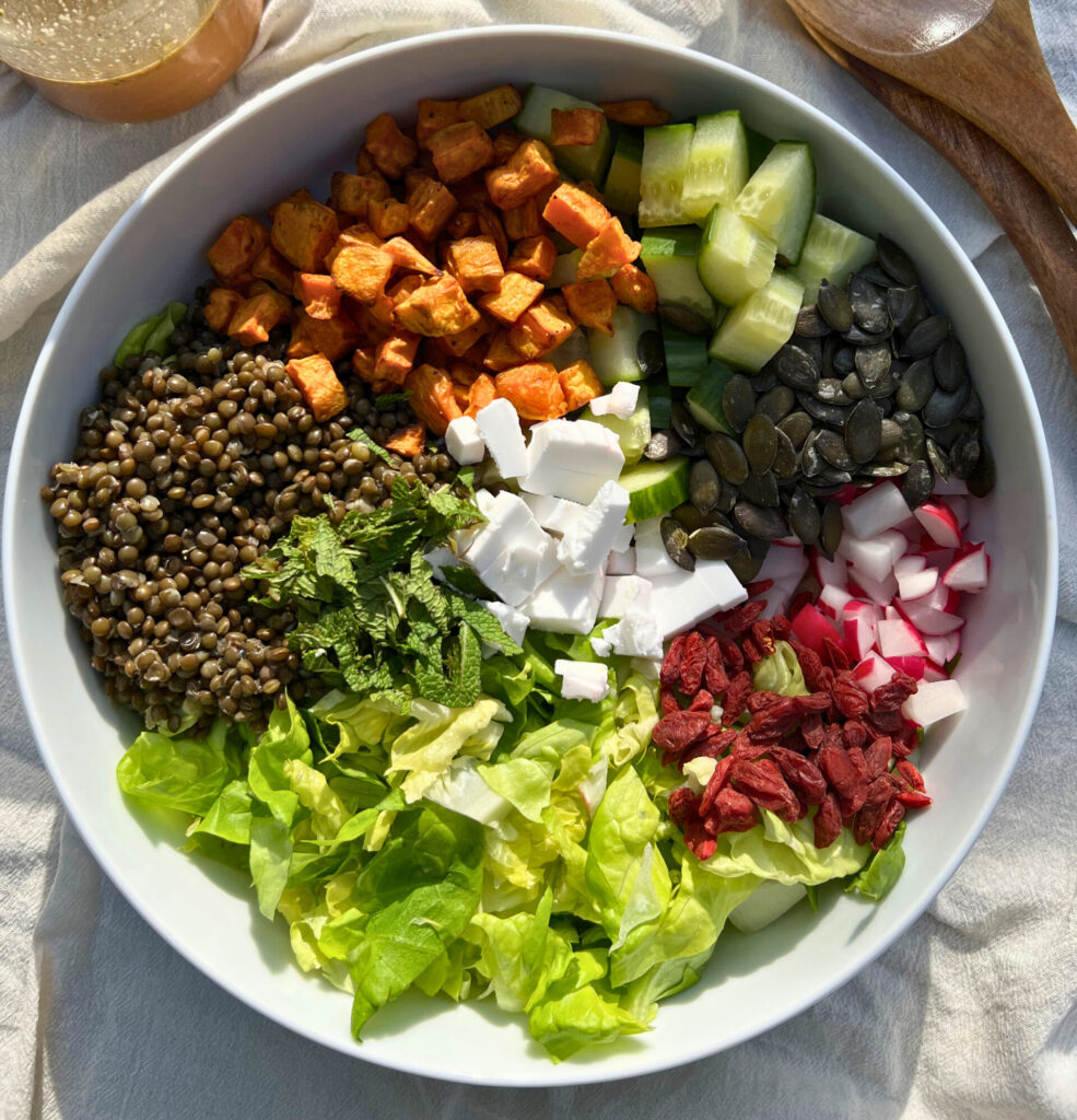 Black lentils and sweet potato salad big and colorful bowl