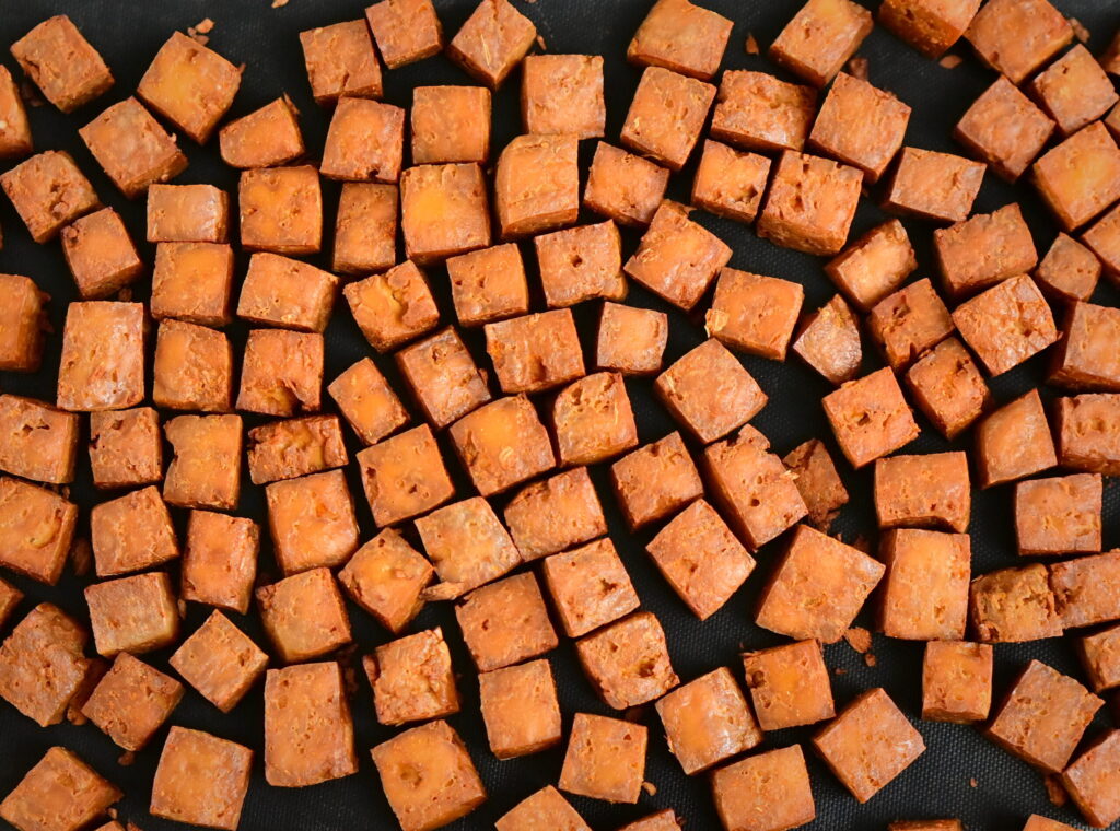 smoked tofu spread on a black surface