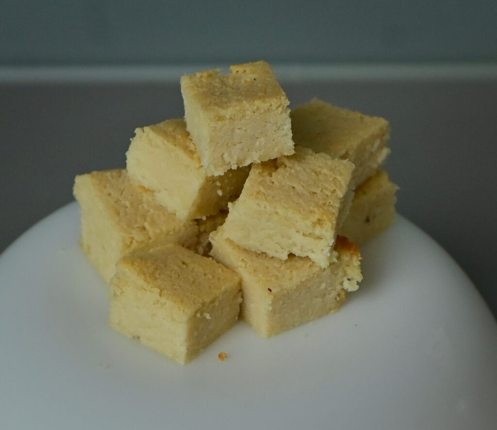 almond feta cubes on a white surface