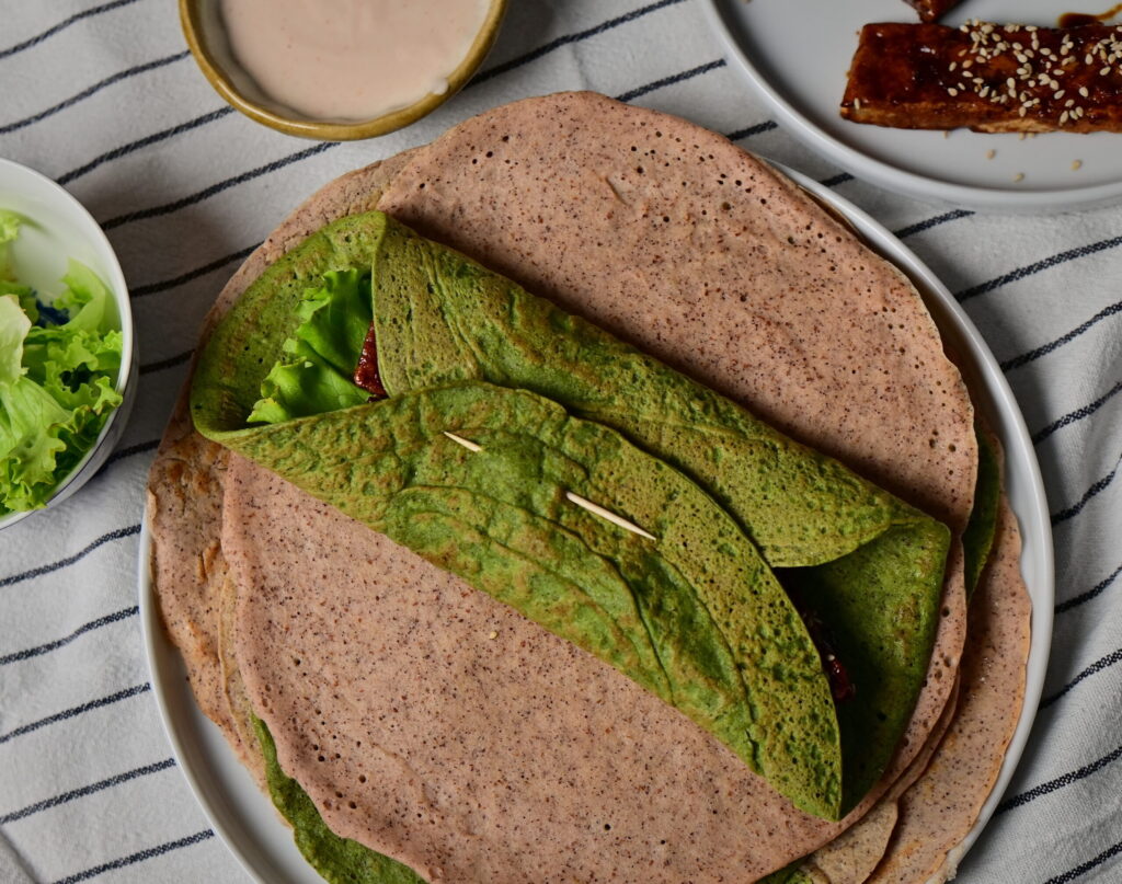 quinoa and red lentils green wraps on a towel
