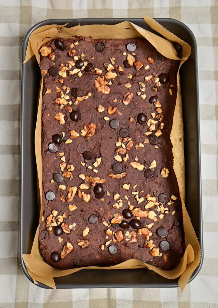 fudgy red bean brownies in a pan on checkered towel