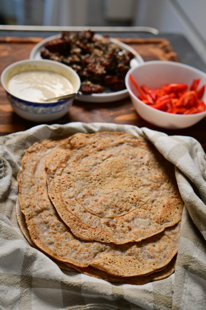 quinoa and red lentils green wraps on a towel