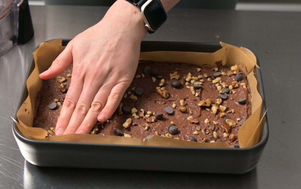 Add and gently tuck in the toppings