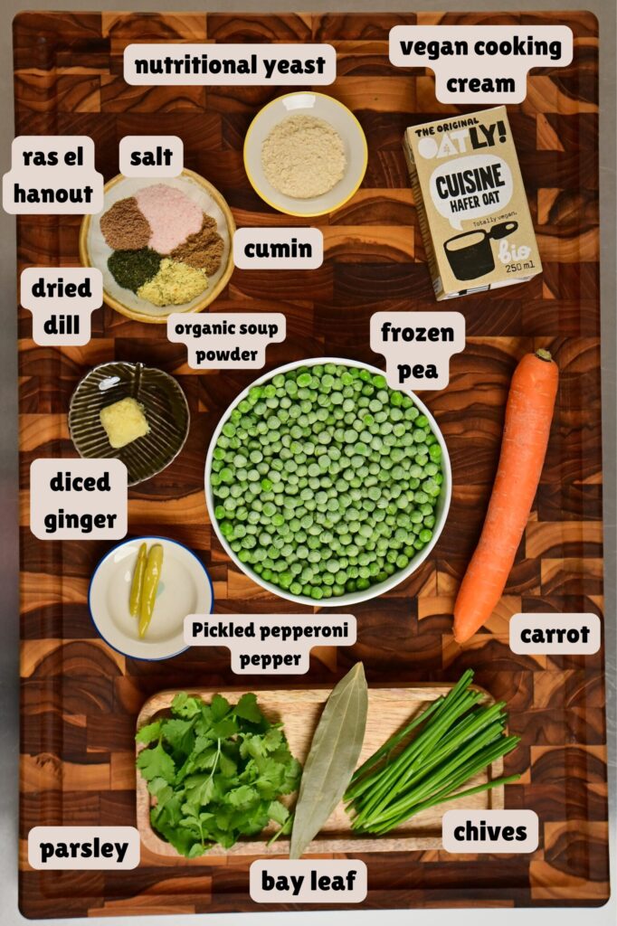 Pea soup ingredients arranged on a checkered wooden cutting board.