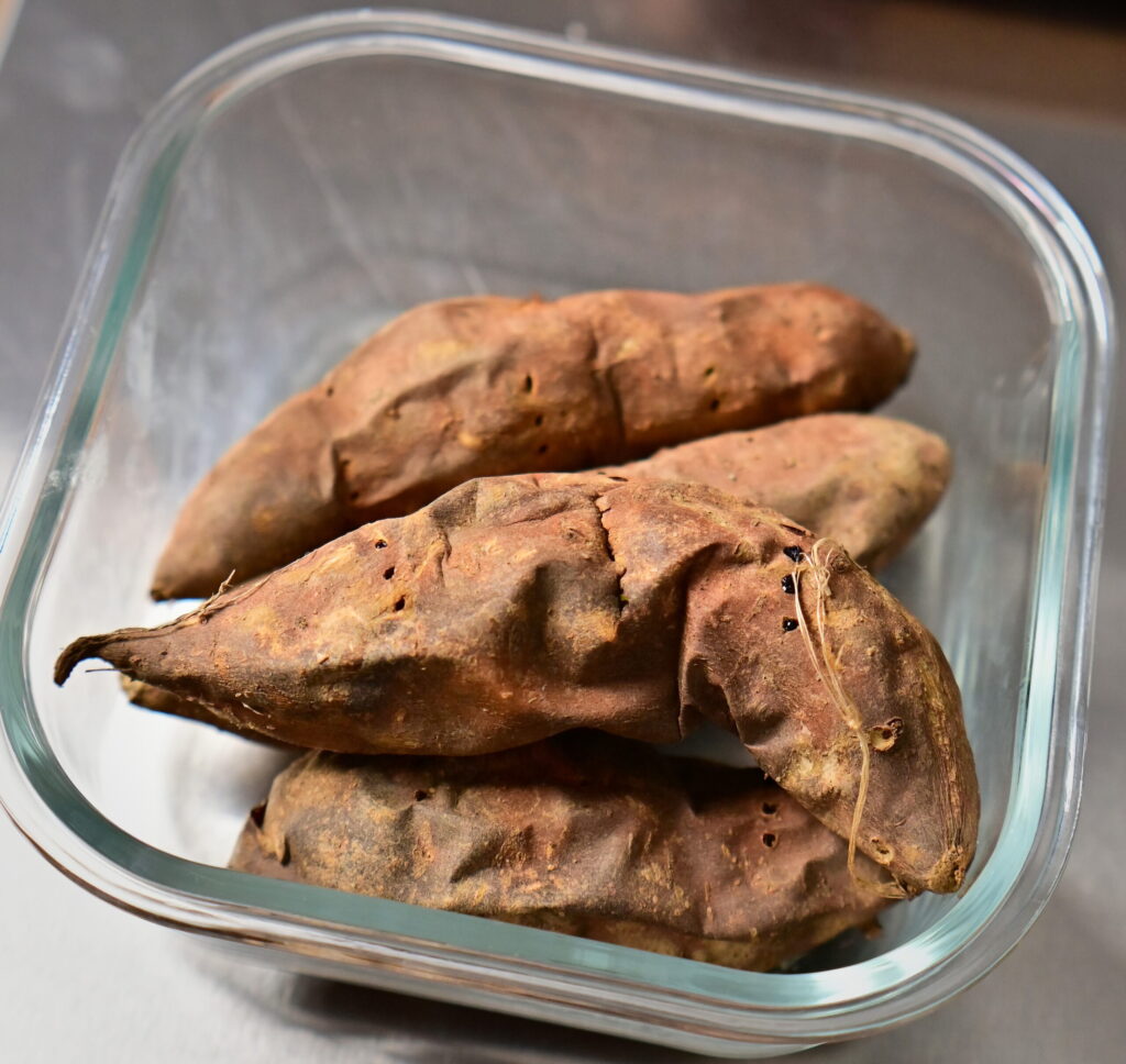 baked sweet potatoes with skin in glass container