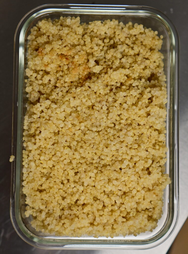 cooked quinoa in a glass container