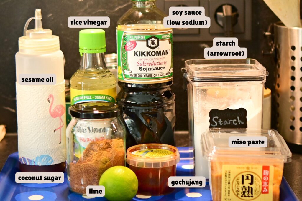 Sauces for the Korean stew broth, arranged on a tray with labels.