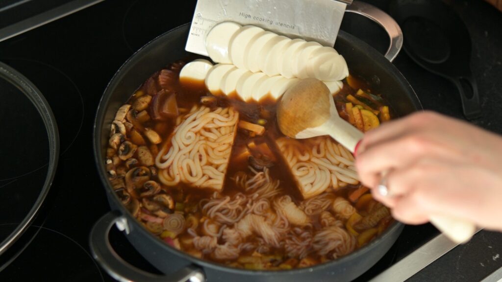 Add the noodles and silken tofu