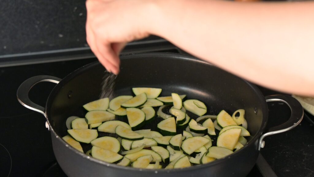 Cook the onion and add zucchini