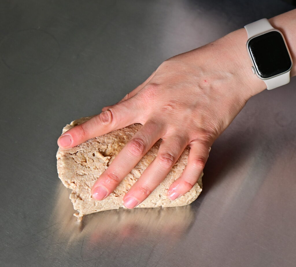 Lightly flour your work surface and transfer the dough onto it.