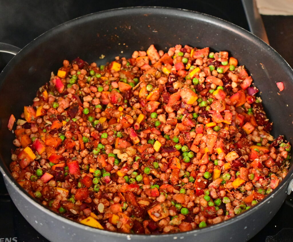 Add the spices, chopped walnuts and frozen peas.