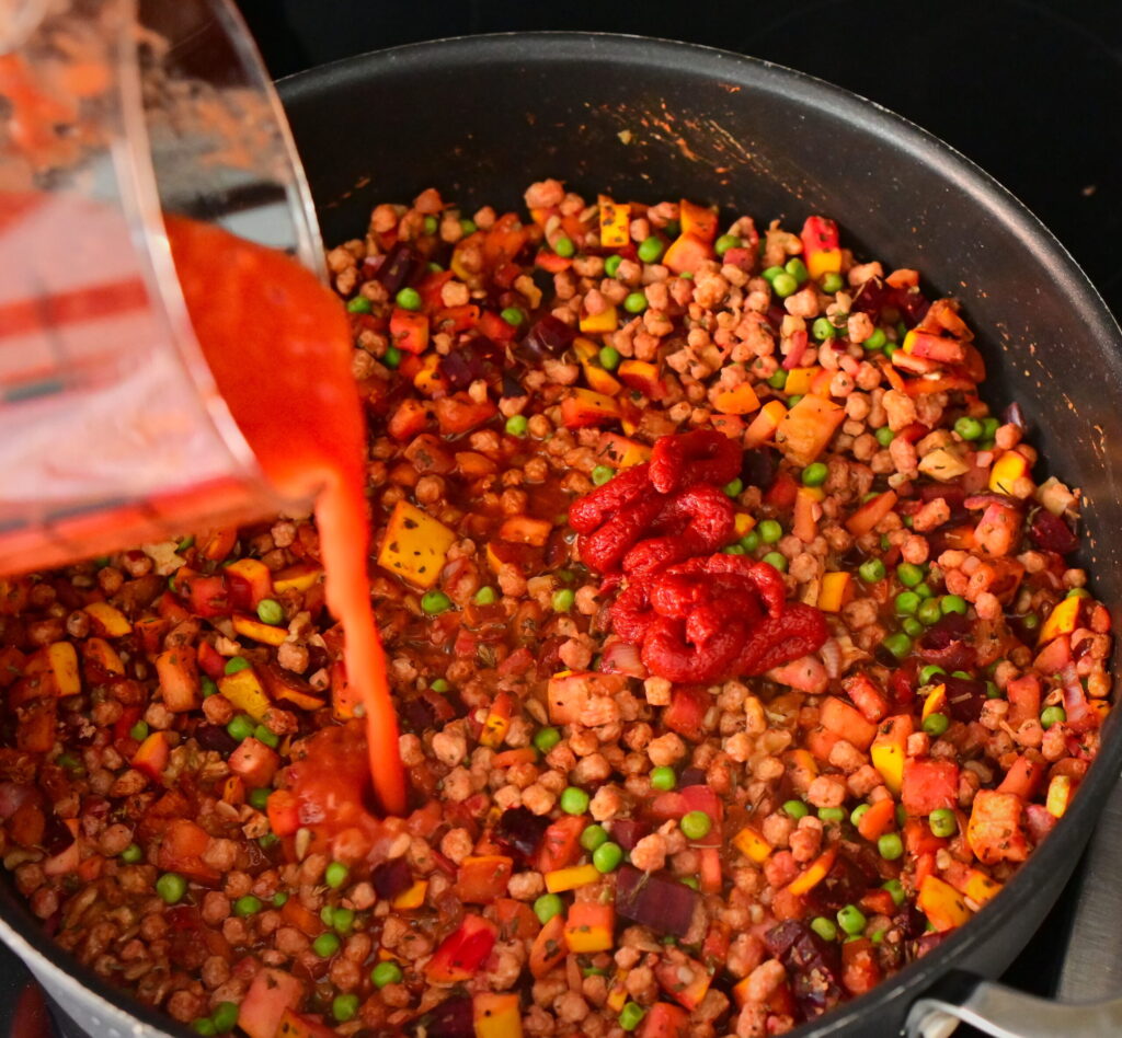add the boiling water and tomato sauce
